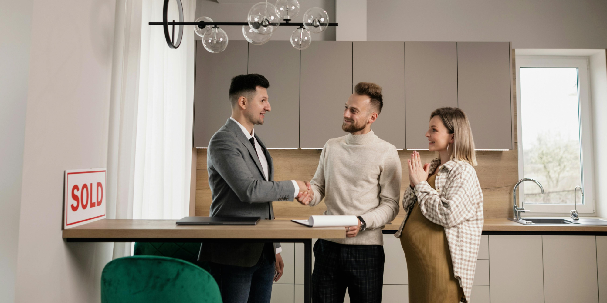First-Time Homebuyer’s Guide: Real estate agent sealing the deal to new homeowners